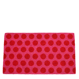 Coir doormat with red spots on pink surface