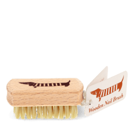 Wooden nail brush with sausage dog printed on the handle and a tag