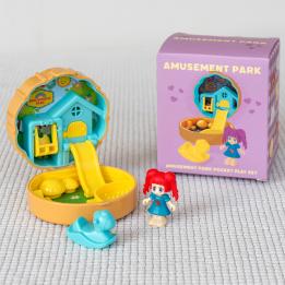 Amusement park play set in a yellow and blue with packaging box in the background