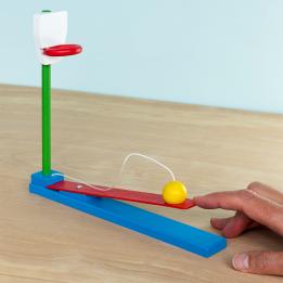 wooden tabletop basketball game with a yellow ball