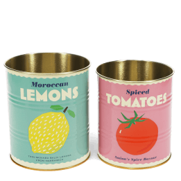 Two vintage-style storage tins, one with a lemon print and one with a tomato print.