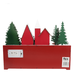 Back of a wooden advent calendar featuring green trees and red houses, with a battery compartment and a barcode label 