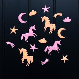 Assorted glow-in-the-dark unicorn featuring stars, moons, and clouds on a black background