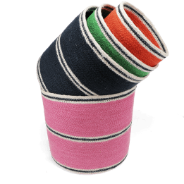 Four woven storage baskets in varying sizes and colours stacked