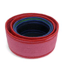 Stacked woven storage baskets in varying sizes and colours