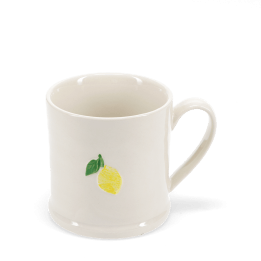 Stoneware mug featuring a yellow lemon print with green leaves and handle 