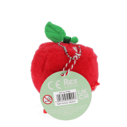 Red apple-shaped plush wind-up toy with a tag