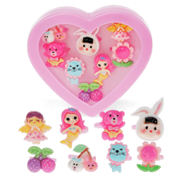 Assorted colourful rings with animal, mermaid, flower, and fruit designs in a pink heart-shaped box