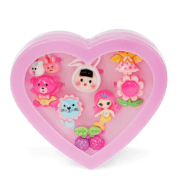Assorted colourful rings with animal, mermaid, flower, and fruit designs in a pink heart-shaped box