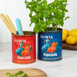 Two cerveza Española tins used as utensil holder and plant pot.
