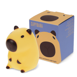 Yellow capybara night light with dark brown ears, shown next to its yellow packaging box