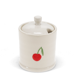 stoneware sugar pot with lid on, featuring a red cherry print and a small handle on top