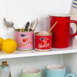 Two mini storage tins used as utensil holder 