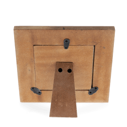 Back of a wooden square picture frame with black metal clips and a stand 