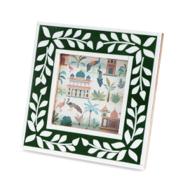 Square green picture frame with white leaf patterns on the border.