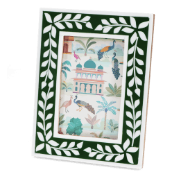 picture frame with a green border and white leaf patterns