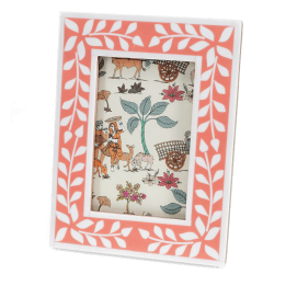 picture frame with a pink border and white leaf patterns