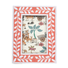 picture frame with a pink border and white leaf patterns