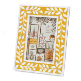 picture frame with a mustard yellow border and white leaf patterns