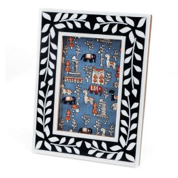 picture frame with a navy blue border and white leaf patterns