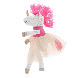 Knitted unicorn toy wearing a pink top and skirt
