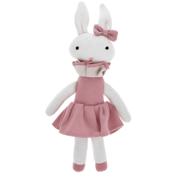 Knitted rabbit toy with long ears, wearing a pink dress with a ruffled collar and a matching bow on one ear