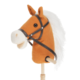 hobby horse toy with white mane and black bridle on a wooden stick
