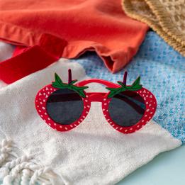 Red strawberry-shaped funglasses with green leaves, and dark round lenses