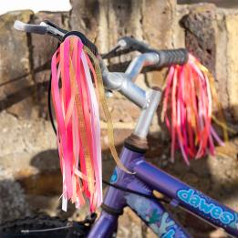 Bike streamers with red and pink ribbons fixed in bicycle handle