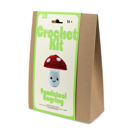 Crochet kit front packaging with printed toadstool design