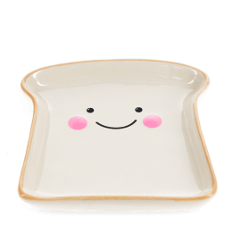 Ceramic trinket dish shaped like a slice of bread with a smiling face and pink cheeks