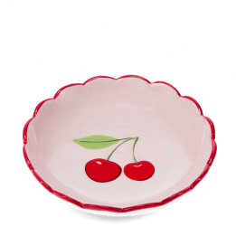 round ceramic trinket dish with scalloped red edge and cherry design in the center