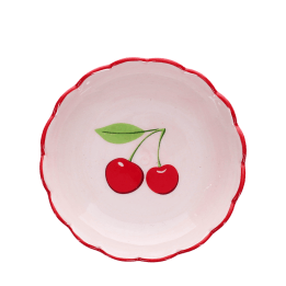 round ceramic trinket dish with scalloped red edge and cherry design in the center