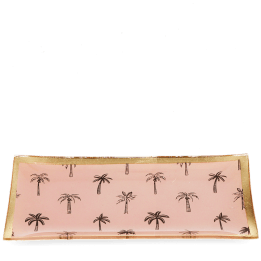 Rectangular trinket dish with gold rim and palm tree pattern on a pink background