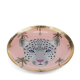 Round trinket dish with gold rim, pink background, palm tree pattern, and a leopard face design