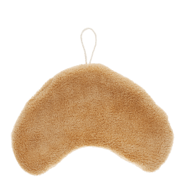Back of a brown kitchen cloth shaped like a croissant with hanging loop