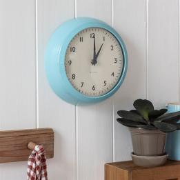 Round blue wall clock with black hands and numbers