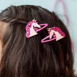 Pair of pink hair clips with glittery unicorn heads