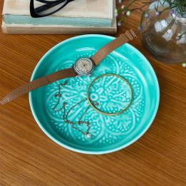 Enamel trinket dish in aqua displayed with a watch and jewellery