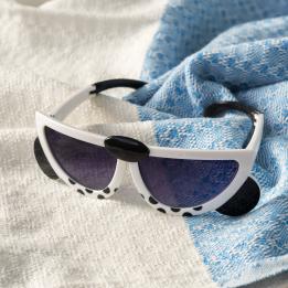 sunglasses with white snow leopard design, black spots, and dark lenses