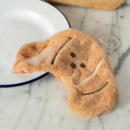 Brown kitchen cloth shaped like a croissant with hanging loop