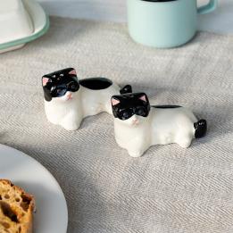 Cat‑shaped ceramic salt and pepper shakers .