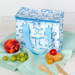 A light blue insulated lunch bag decorated with bow patterns.
