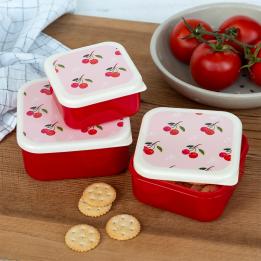 A set of three cherry‑pattern snack boxes displayed with cookies.