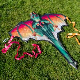 A giant dragon kite. Designed in a fantasy-inspired style with vivid colours and streaming ribbon tails