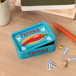 Mini storage tin with paprika illustration on the front.