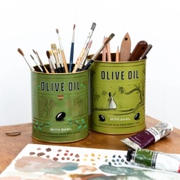Two green olive oil storage tins, featuring illustrated trees and olives.