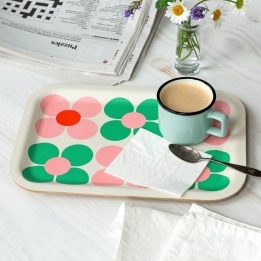 Wooden tray with pink and green daisy design, shown with a mug, spoon and napkin.