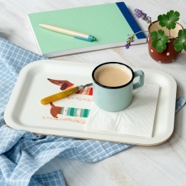 Wooden tray with sausage dog design, shown with a mug and napkin.