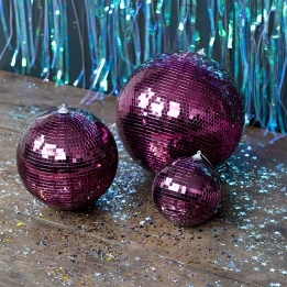 Plum hanging disco ball ornament with mirrored tiles shown in different sizes.